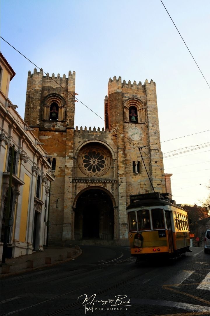 Tram 28 passing in from of the 13th-century Cathedral in Lisbon.