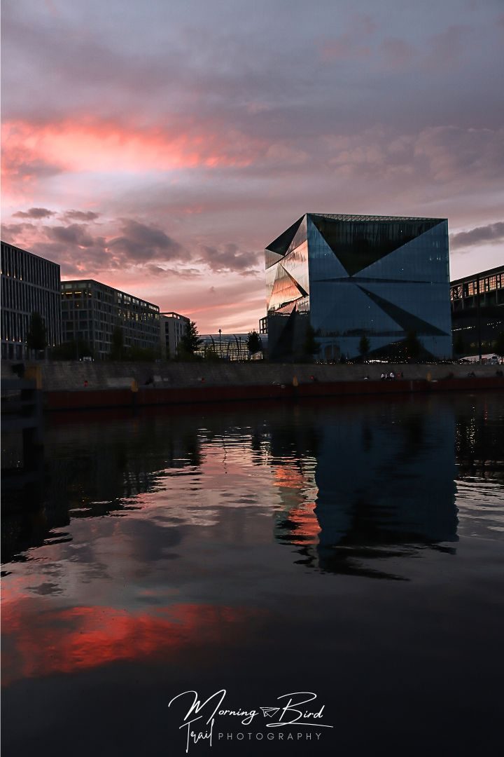 Photo of sunset at Spreebogenpark reflectin on the Spree and the Cube